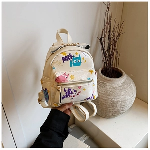 Detail of cream mini backpack with graffiti art and decorative leather bow handle