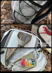 Detail view of woven side mesh pocket and reinforced handle on gray outdoor backpack