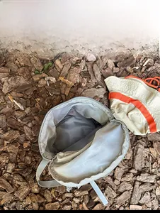 Top view of open light grey outdoor backpack showing large internal storage capacity
