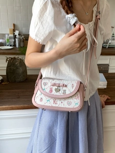 Pink ballet-style crossbody bag with cute ribbon bow and cartoon animal patterns