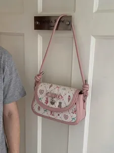 Pink and white ballet-style crossbody bag with cute cartoon prints and bow details