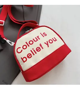Detailed close-up of red and white bowling bag fabric texture and logo print
