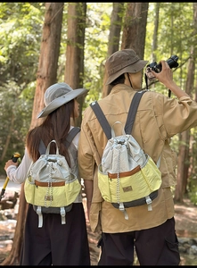 Detail of color-block drawstring backpack in nylon for outdoor travel and hiking