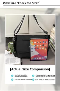 Macro shot showing interior capacity of black nylon messenger bag fitting an iPad and A4 files