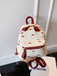 Mini cream backpack with red polka dots and bow print for women stylish commute