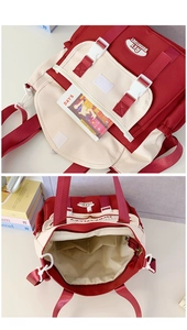Detail view of red and white canvas backpack with secure buckles and internal compartments