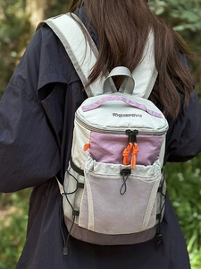 Outdoor hiking backpack for women in green and purple colors with large mesh pocket