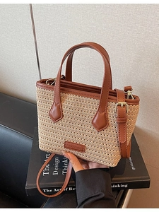 Knitted bucket bag with straw texture and brown leather strap for summer fashion