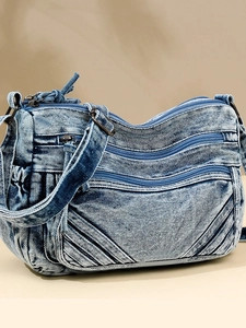 Retro washed blue denim crossbody tote bag with multi-zipper pockets and quilted design