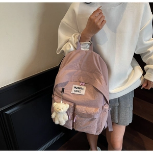 Zaino in tela rosa con applicazione di lettere e dettaglio ciondolo orsetto di peluche