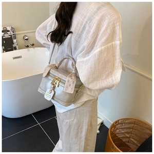 Chic silver-grey crossbody box bag with a silk scarf handle wrap and gold hardware