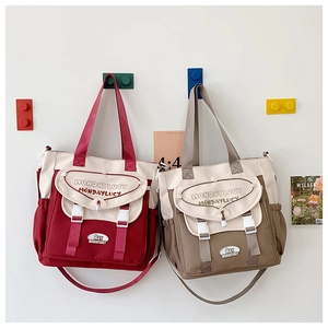 Detail of canvas tote bags with adjustable straps and multi-pocket functional design