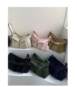 Detailed display of multi-pocket canvas crossbody bags in six assorted casual colors