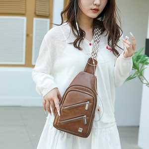 Brown PU leather chest bag with multi-zipper compartments and patterned strap