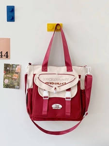 Versatile burgundy and beige canvas messenger bag with large capacity for commuting