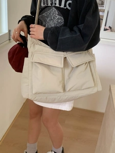 Minimalist off-white large canvas tote bag with front flap pockets for women