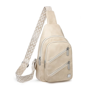 Detail of beige crossbody bag with silver zippers and geometric patterned wide strap