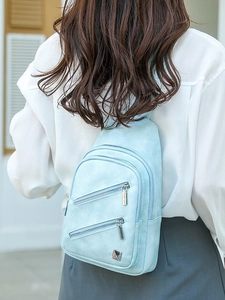 Light blue faux leather crossbody chest bag with silver zippers for women traveling
