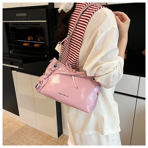Pink patent leather tote with bow and lock charm detail and silver chain strap