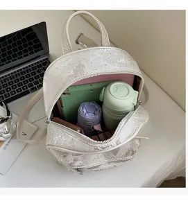 Detail of backpack interior showing space for tablet, water bottle, and daily essentials