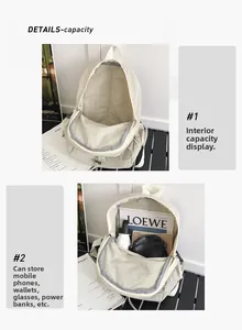 Detail view of the backpack's spacious main compartment with grey lining and zipper
