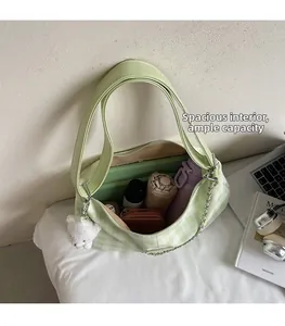 Interior view of green plaid tote bag showing spacious capacity for tablets and books
