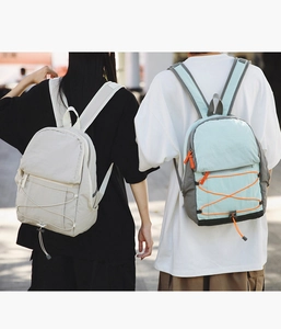 Detail view of stylish lightweight outdoor backpacks with adjustable straps and elastic cords