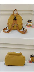 Details des gelben Canvas-Rucksacks mit verstellbaren Trägern und breiter Bodenstruktur