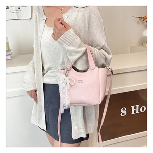 Pink lychee texture leather bucket bag with lace pearl charm and silver accents