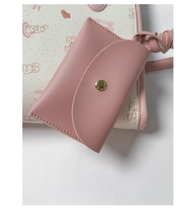 Close-up of pink PU leather card holder with gold snap button and stitched details