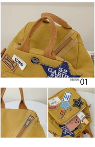 Detail eines gelben Canvas-Rucksacks mit Vintage-Stickereien und funktionellen Taschen