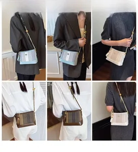 Detailed views of mini striped tote bags with chain straps and gold ball adjusters