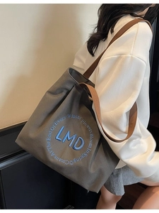 Deep grey canvas tote bag with blue towel embroidery logo for daily work commute