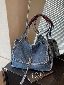 Retro washed denim tote bag with vintage metal turn-lock and brown top handle detail