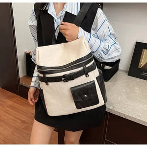 Detail of the high-quality lychee texture and contrasting colors of the vintage backpack