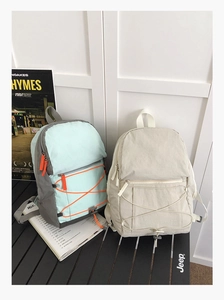 Detail of lightweight waterproof nylon outdoor backpacks with colorful drawstring zipper pulls