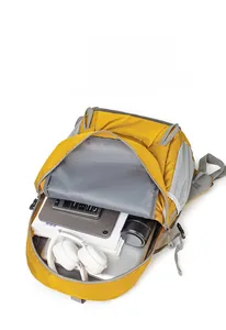 Internal view of yellow backpack showing large capacity for electronics and books