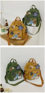 Details des Vintage-Canvas-Minirucksacks mit Retro-Stickerei und funktionalen Taschen
