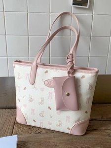 Large cream tote bag with pink cartoon prints and matching mini card holder charm