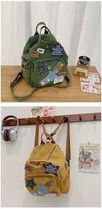 Details von Vintage-Leinwandrucksäcken mit Retro-Stickereien und Reißverschlussfach