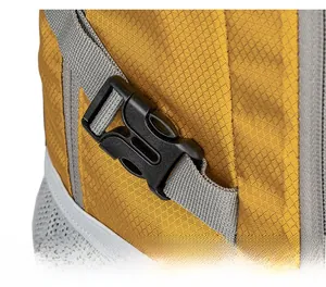 Detail of outdoor backpack featuring yellow ripstop fabric and side buckle adjustment