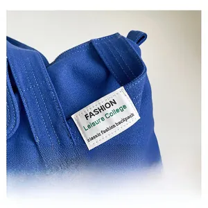 Detail showing high-density blue canvas fabric and the white fashion leisure woven label