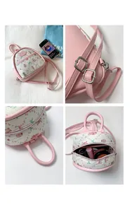 Detail view of pink mini backpack showing adjustable straps and internal storage capacity