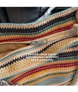 Close-up of smooth silver zipper and colorful woven texture on summer straw tote bag
