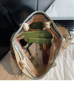 Interior view of colorful striped woven tote bag showing large storage capacity