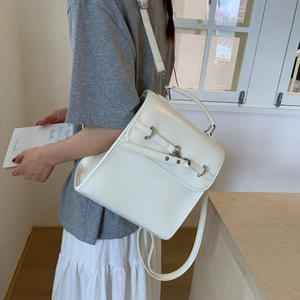 Side view of a creamy white structured shoulder bag with sleek PU leather finish