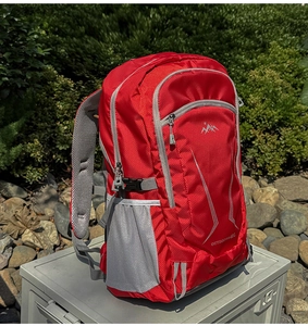 Detail of red and grey 40L outdoor backpack with breathable honeycomb mesh straps