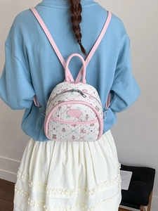 Mini floral backpack with bear and strawberry patterns in light beige and pink trim