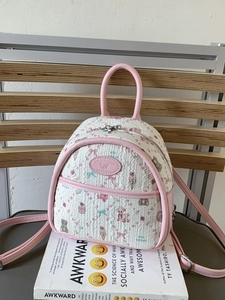 Mini backpack for women featuring pink faux leather and quilted cartoon bear fabric print