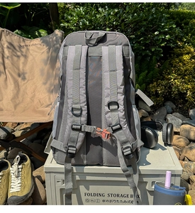 Detail view of breathable mesh back panel and adjustable padded straps on hiking backpack